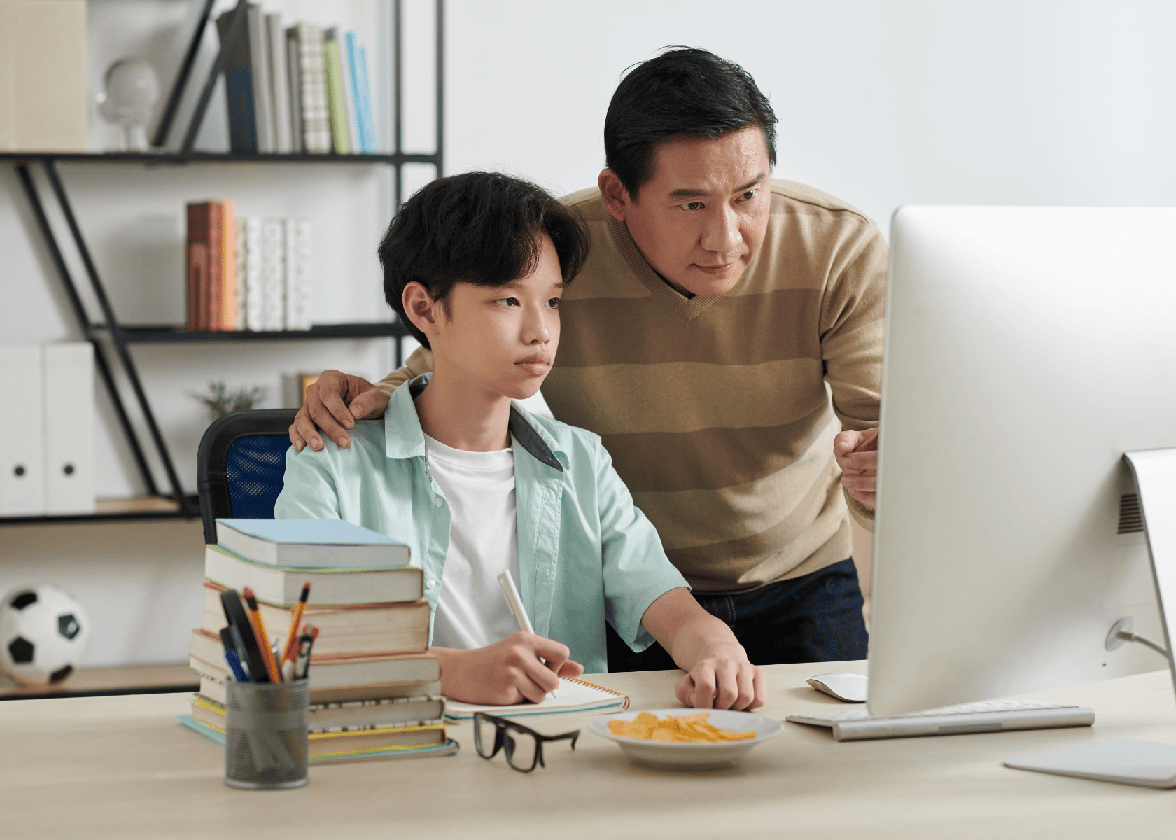 Student preparing for NAPLAN online practice with parent support while working at a computer.