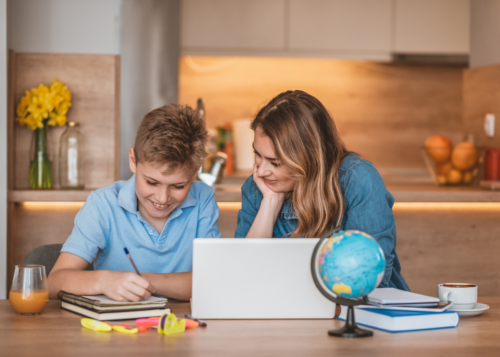 Parent helping child prepare for NSW Selective High School test with study materials at home.