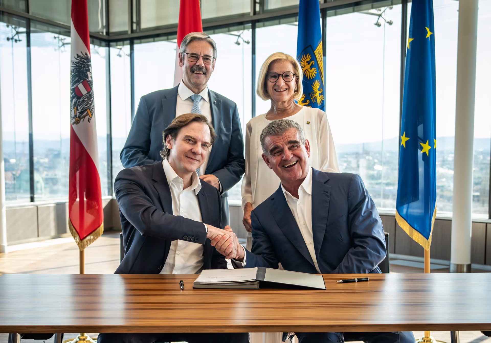 Front row (seated, left to right): Stephan Büttner, Peter Spuhler. Back row (standing, left to right): Erwin Hameseder, Johanna Mikl-Leitner. (Image copyright: AGRANA)