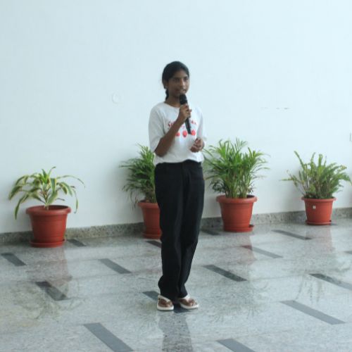 A Quantium student speaking at a school event