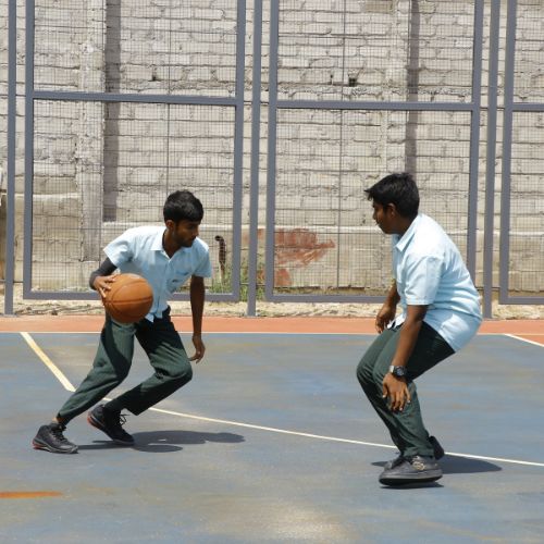 Quantium students playing basketball