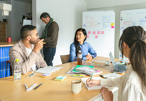 Photo of a client interviewing a local business owner as a part of a group interview