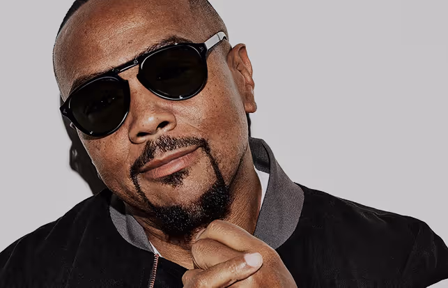 Man Wearing black glasses looking with smile.