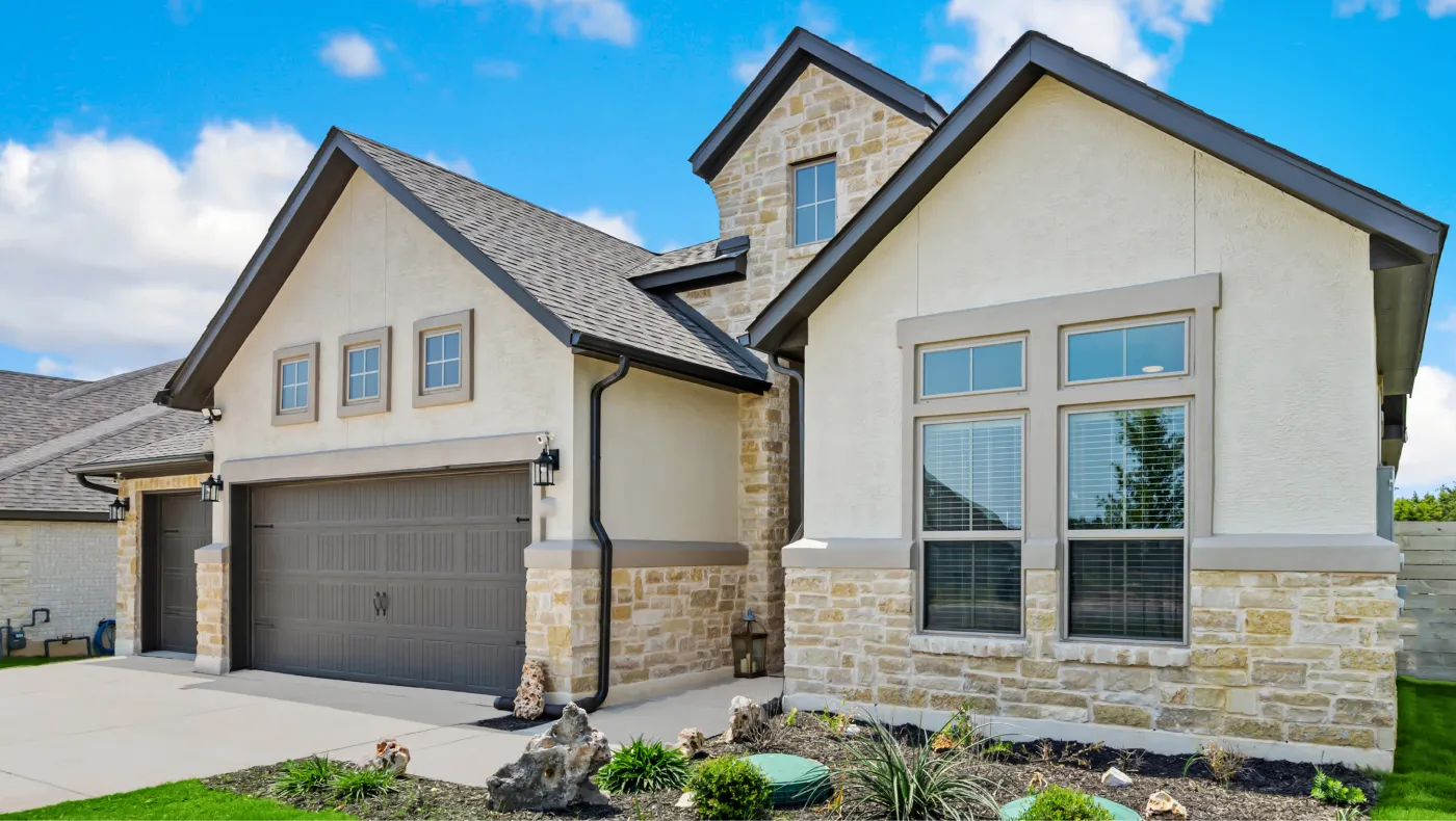 Whole-home exterior repaint on a stucco and siding house