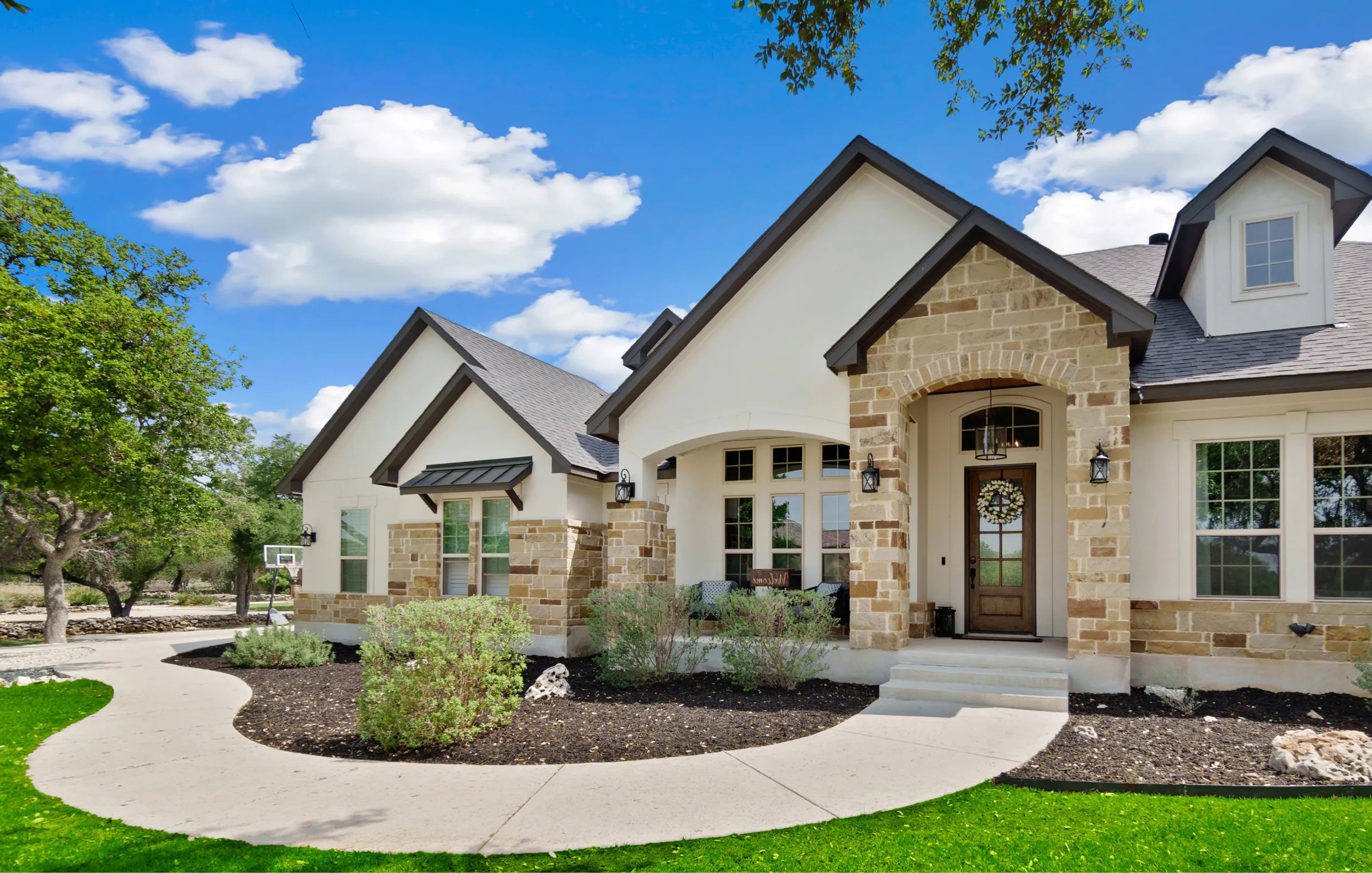 Freshly painted two-story stucco home in San Antonio