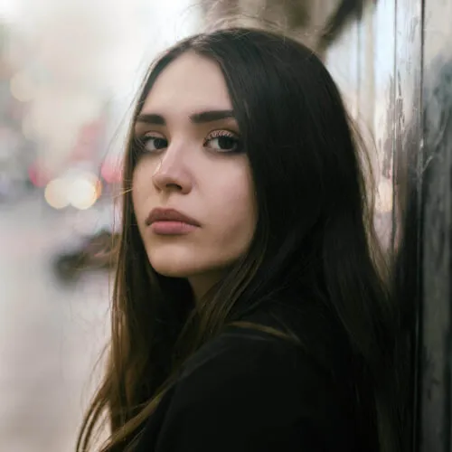 girl wearing black top selective focus photography