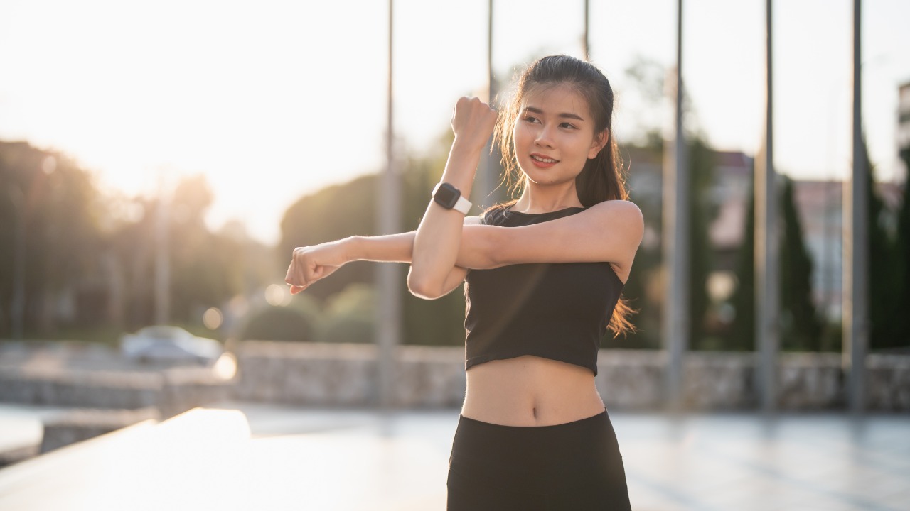 making resolutions - a female student warming up for exercise-img
