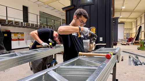 Close‑up of steel‑framed construction for a luxury tiny home, representing durability and long‑term ROI.