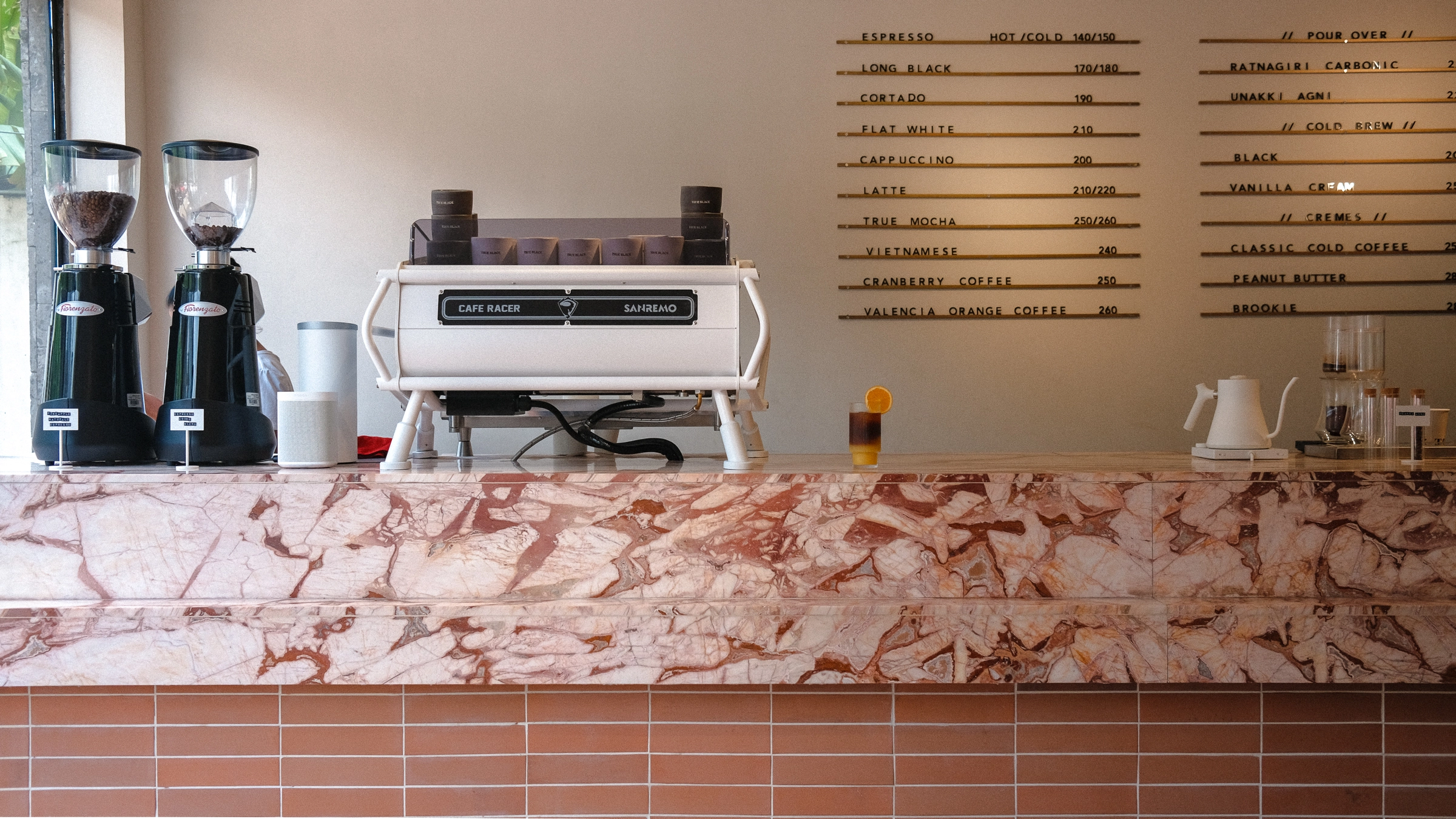 Reminiscent of the first cafe, the architecture translates into the furniture as the material geometry supports the space's tranquility.