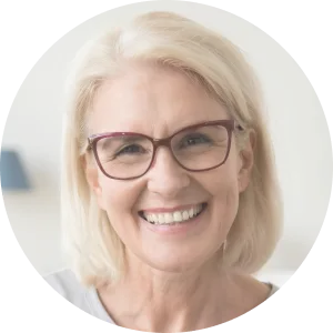 a rounded image of a woman with glasses smiling for the camera