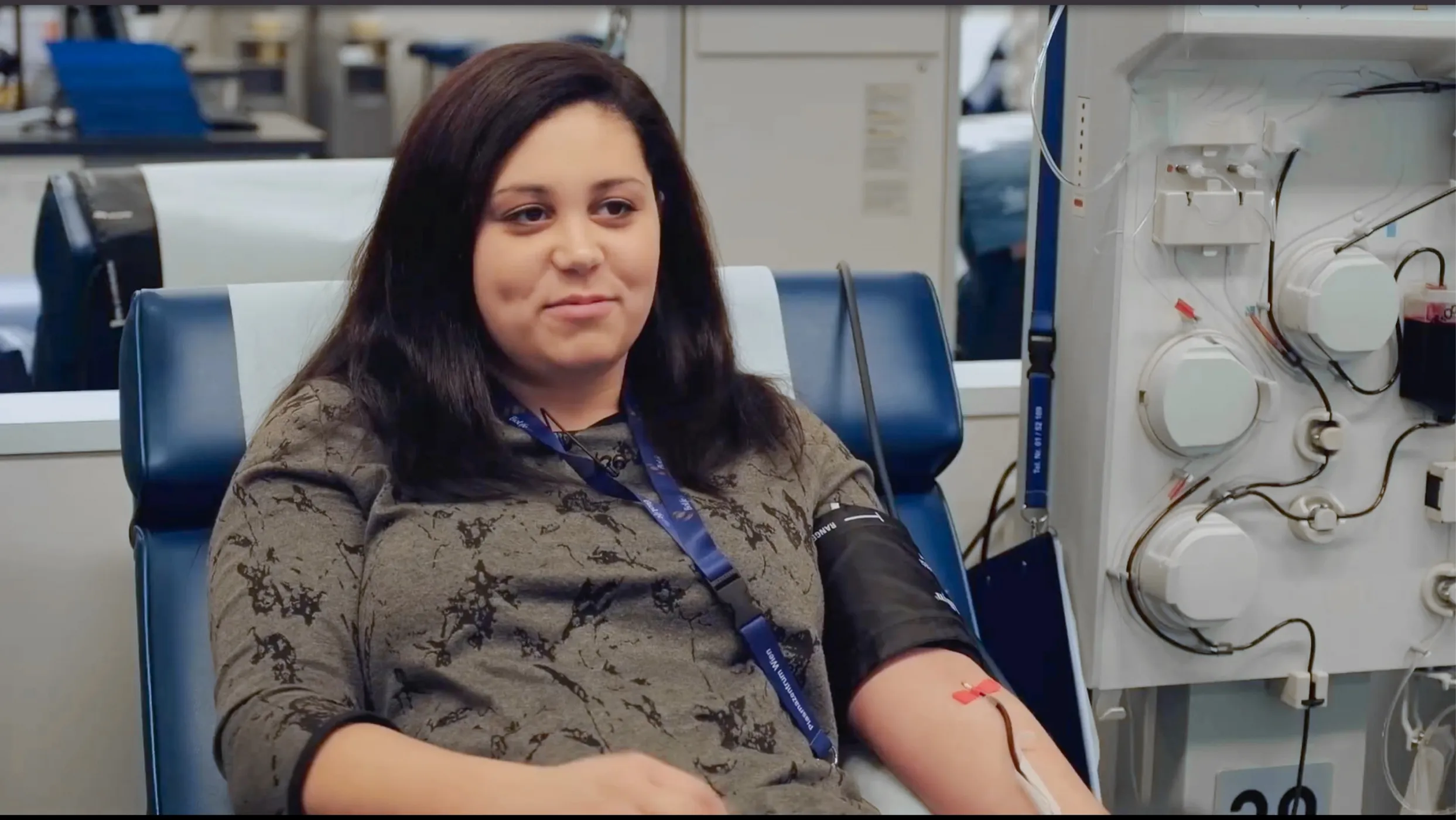A young woman during the plasma donation process.