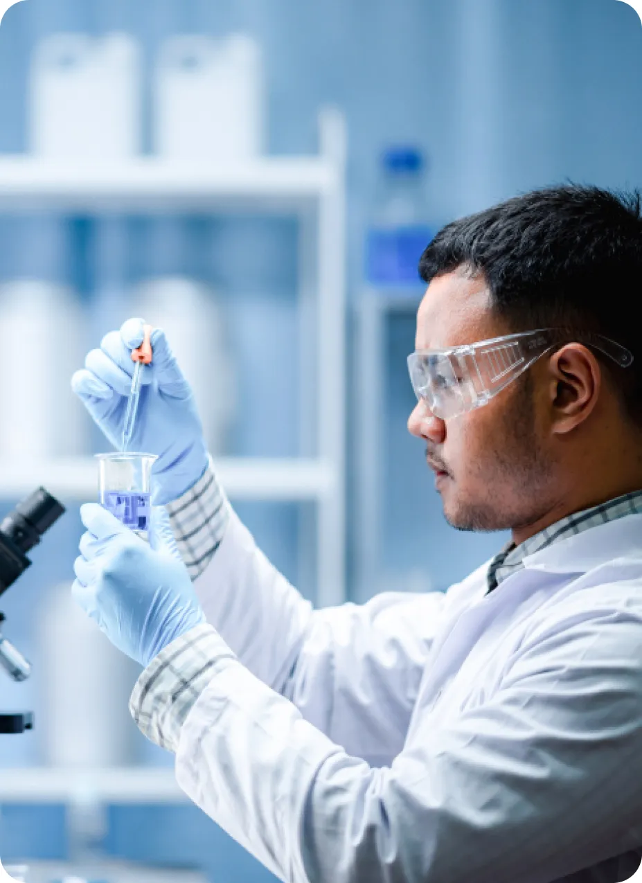 A man that is currently researching in a laboratory. 