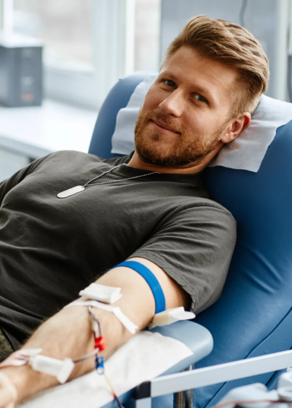 A man is currently donating blood or plasma.