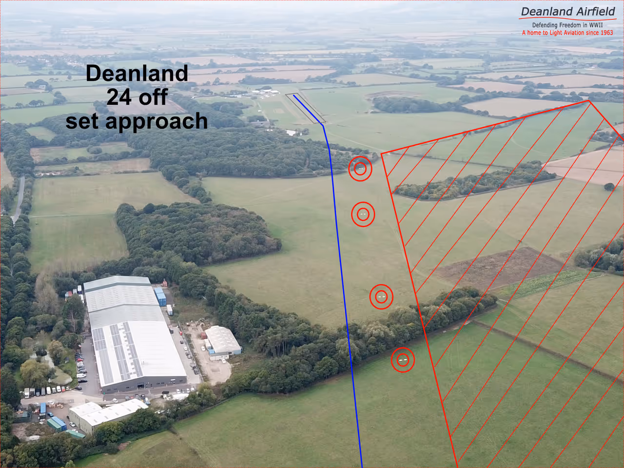 Aerial view shows Deanland Airfield approach path marked with red and blue lines over the landscape.