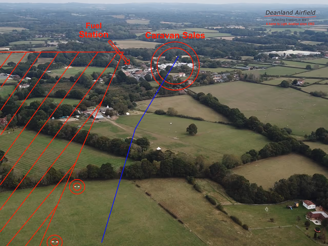 Aerial view of a landscape showing labeled areas for fuel station and caravan sales.