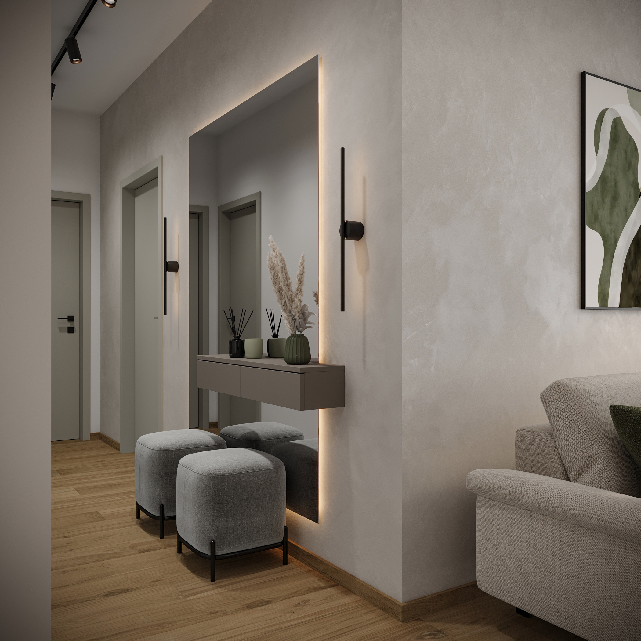 Modern hallway with light wood floor, gray doors, large backlit mirror, floating shelf with decor, two gray ottomans, and part of a beige sofa.