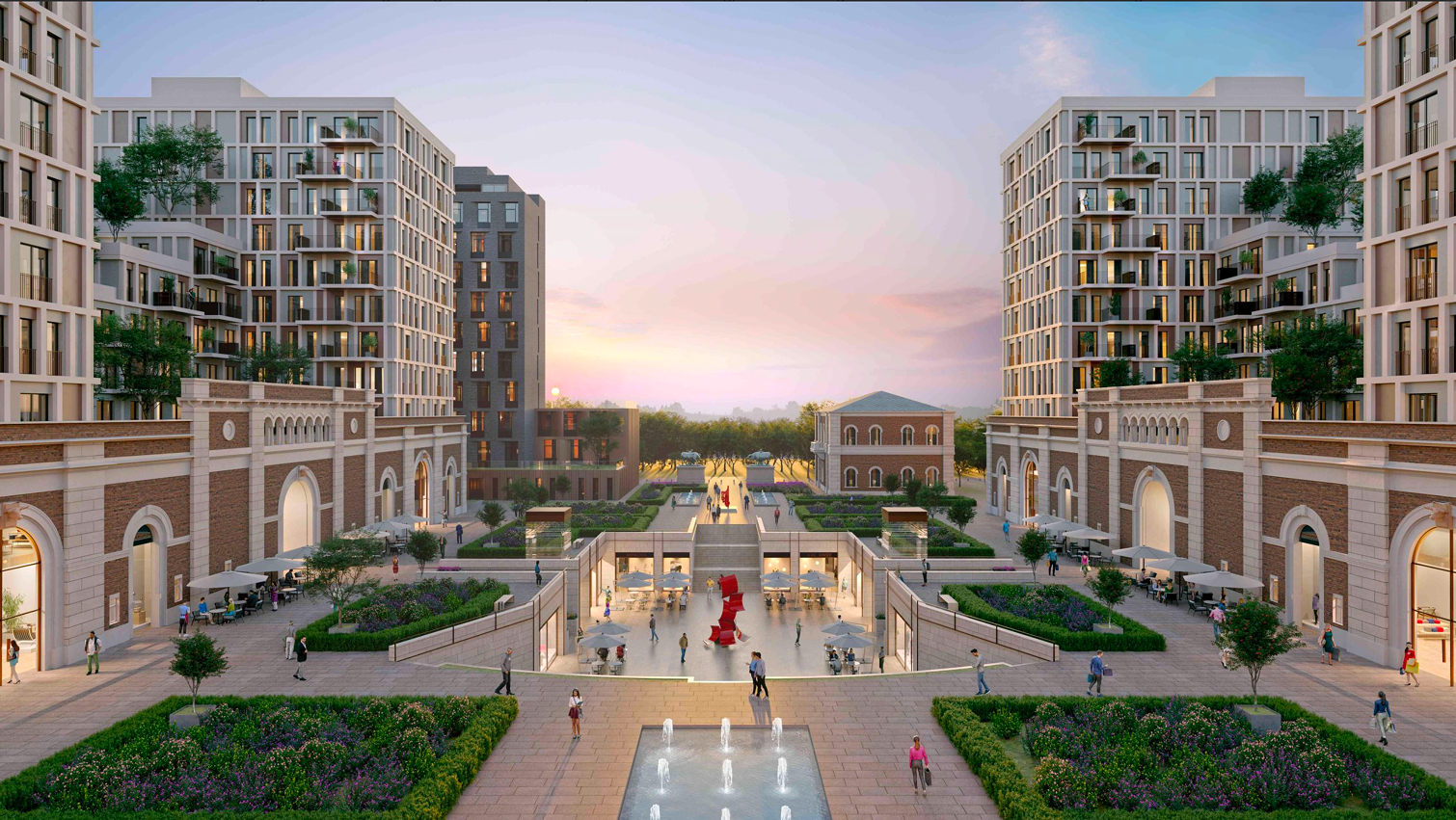 Urban courtyard with modern buildings, green gardens, water fountains, and people walking and sitting at outdoor cafes during sunset.
