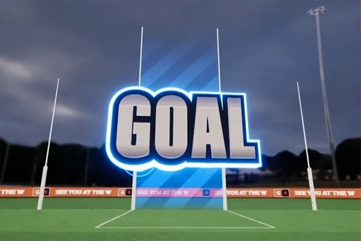 Glowing word GOAL over rugby goalposts on a green field with stadium lights in the background.