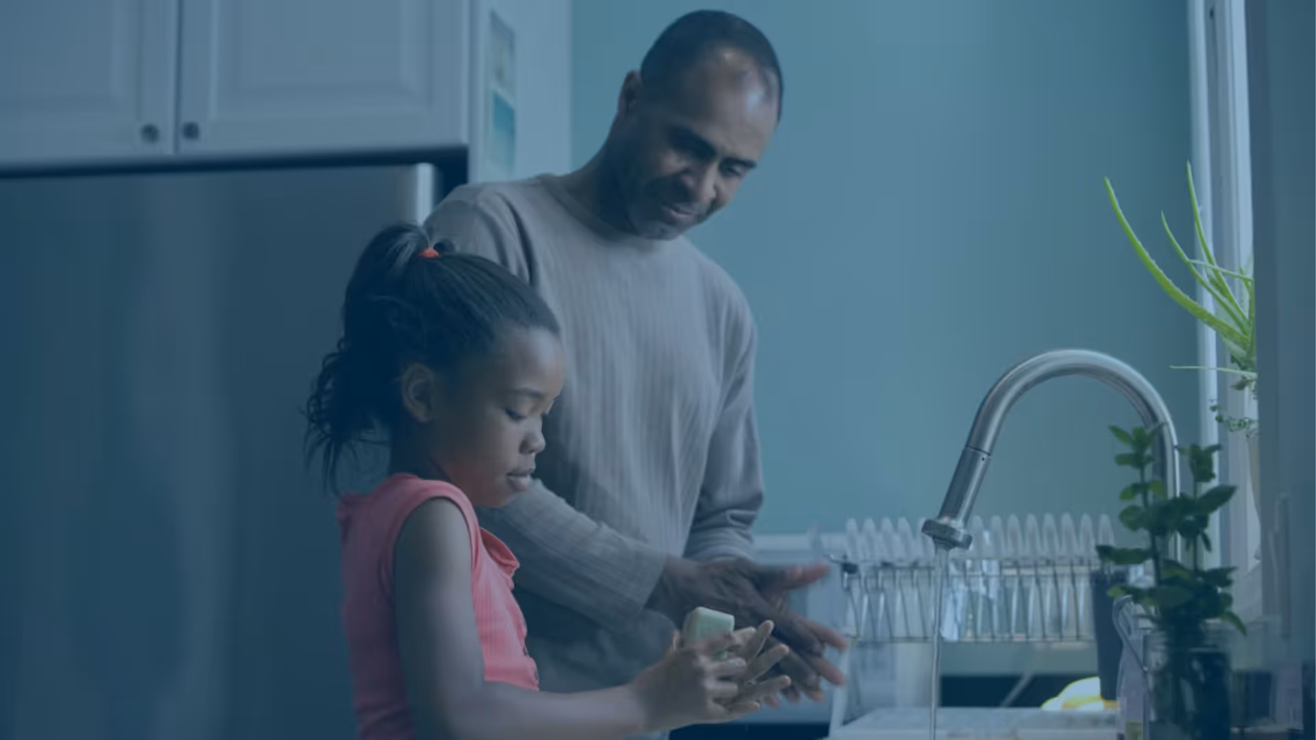 Dad and daughter standing in kitchen