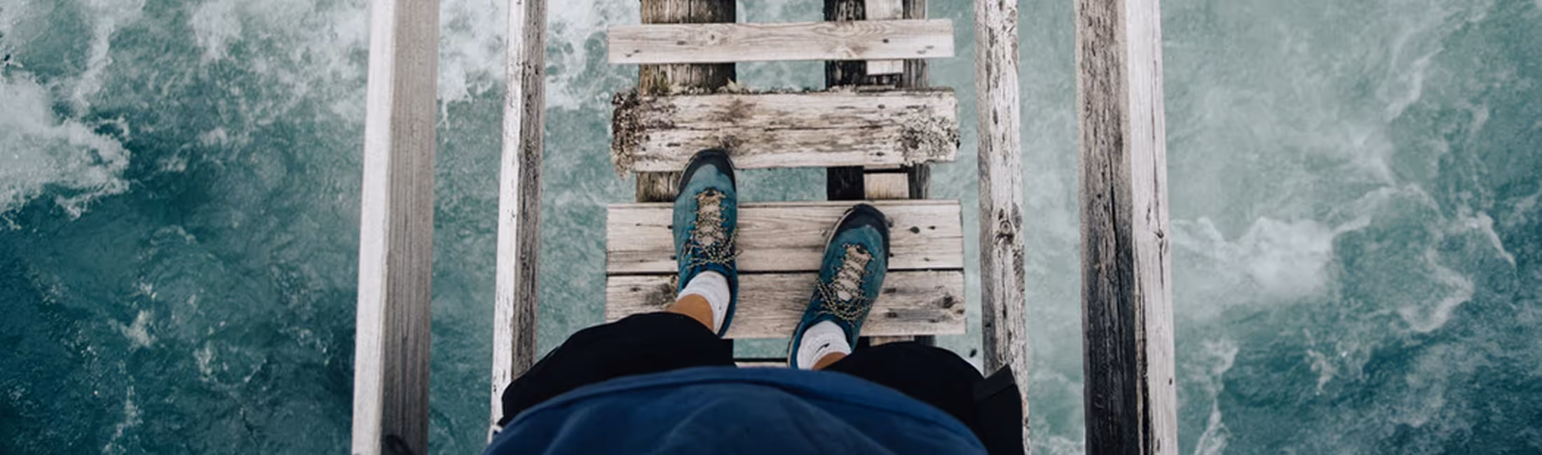 Person walking on old bridge