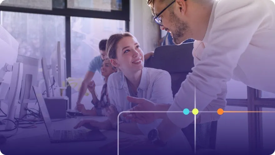 Team members collaborating around a computer in a bright office with purple overlay