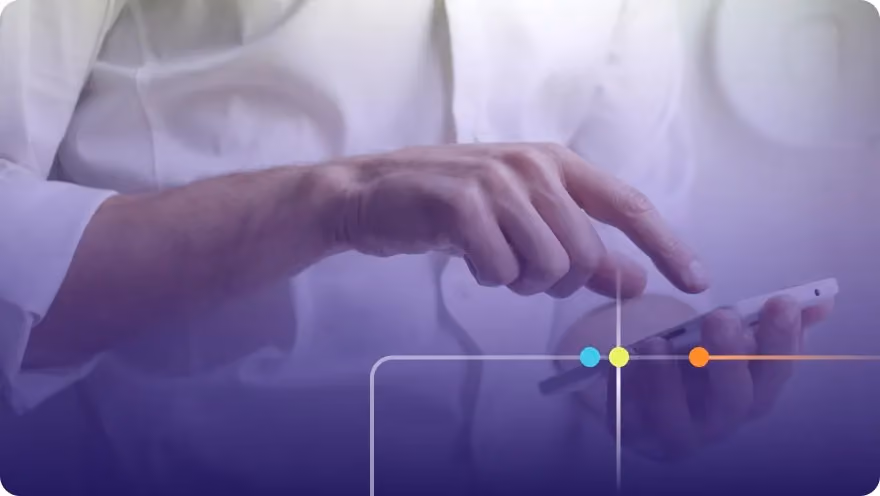 Professional in a white shirt tapping on a smartphone screen