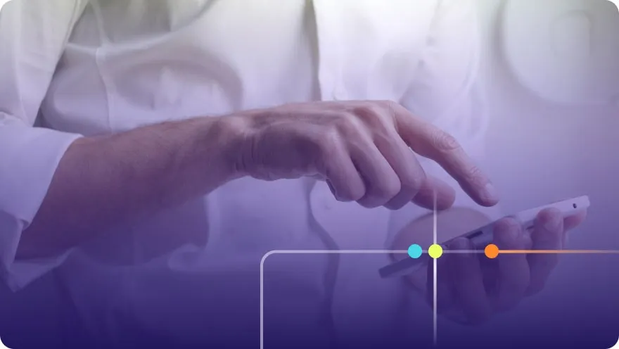 Professional in a white shirt tapping on a smartphone screen