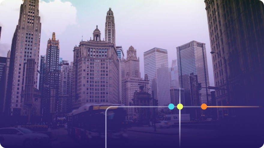 Chicago downtown street view with tall skyscrapers and a bus passing through