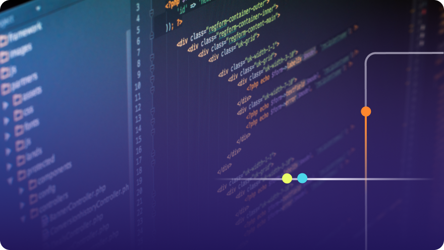 Close-up of colorful source code displayed on a monitor in a dark code editor