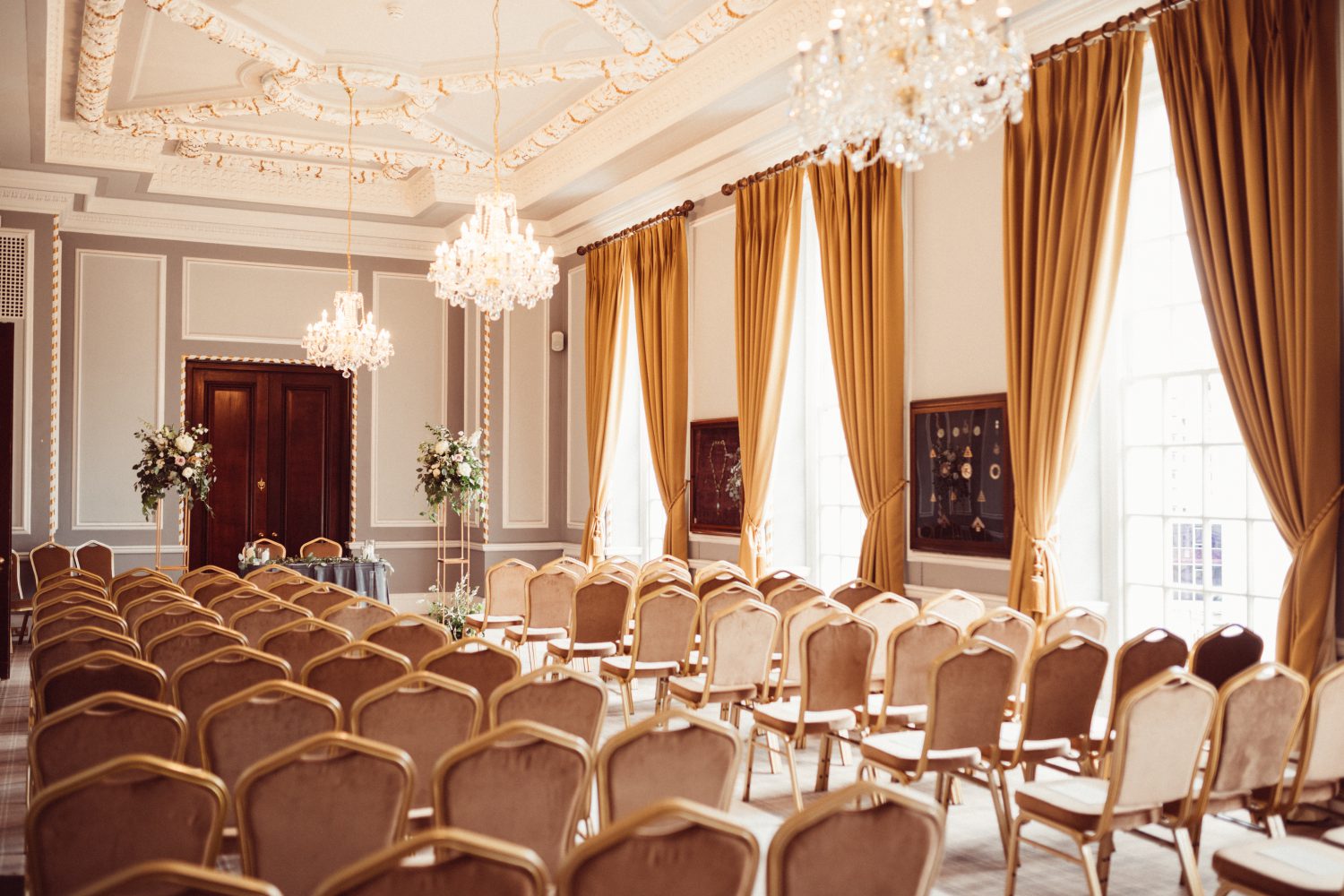 Historic Museum room showing gold-highlighted plasterwork and ornate painted ceiling