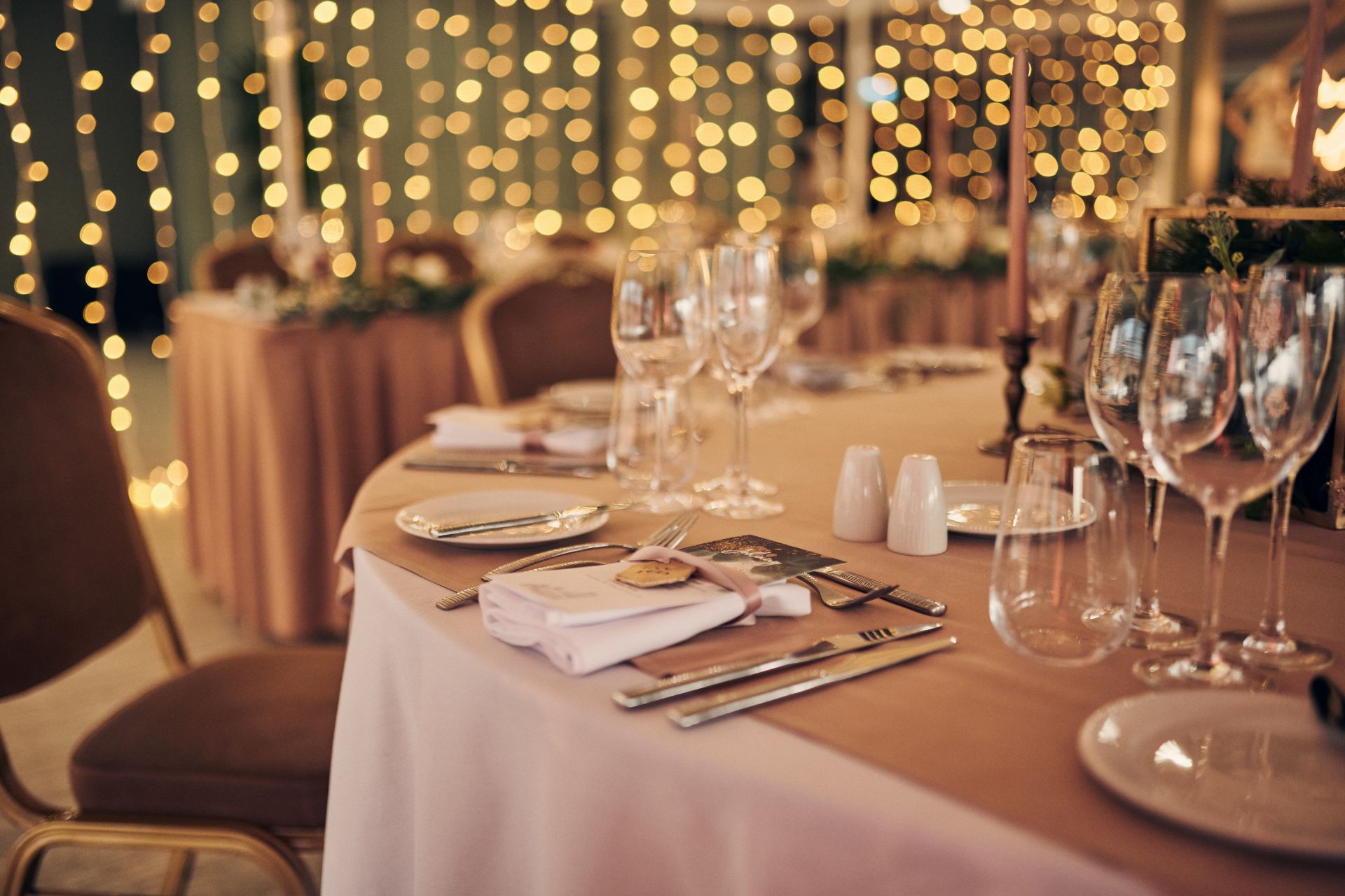 Intimate dinner party beside marble fireplace at Manchester Hall