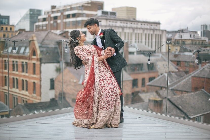 Colourful Asian wedding reception with traditional decorations at Manchester Hall