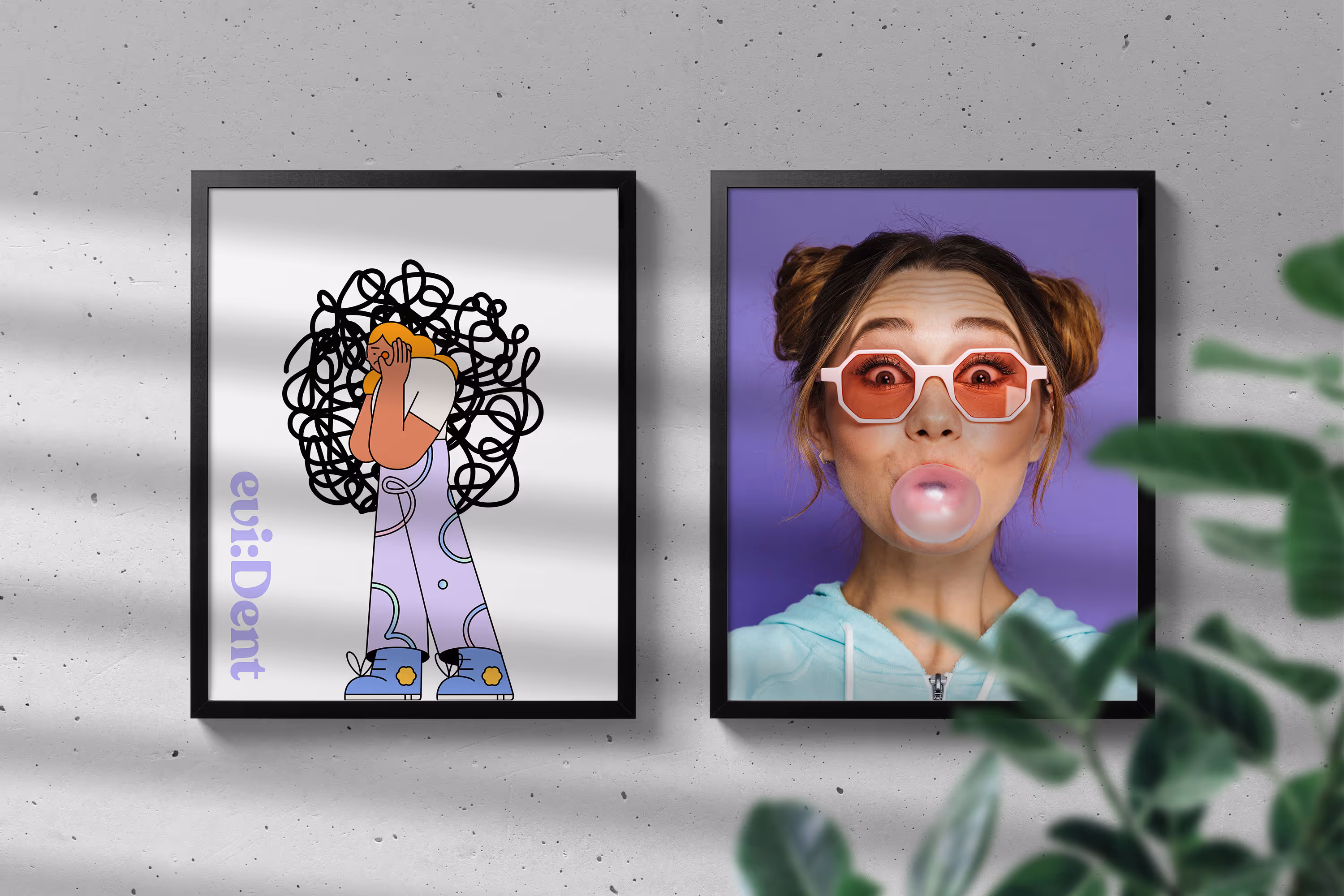 Two framed images on a dental office's wall with shadows and greenery.