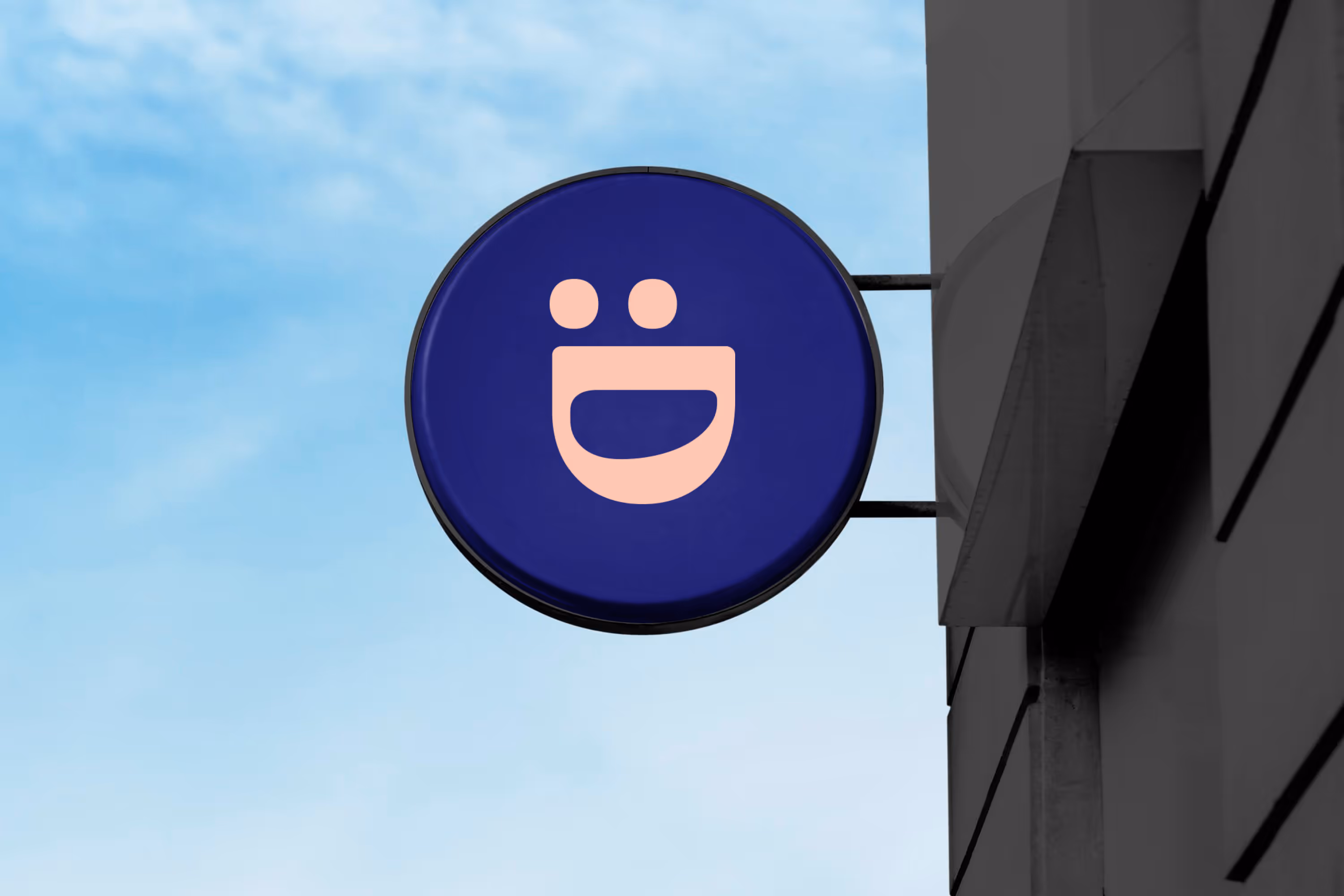 Evident's smiley logo symbol on a wall sign holder
