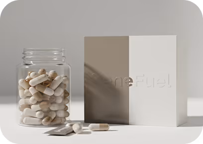 Transparent jar filled with beige and white capsules next to a brown and white box embossed with the word 'GeneFuel'.