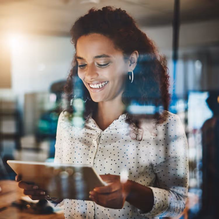 White miniature human figures positioned on a dark blue circuit board pattern symbolizing digital networking and connectivity.