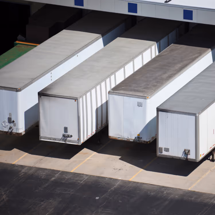 White miniature human figures standing on interconnected white circuit lines on a dark blue background.