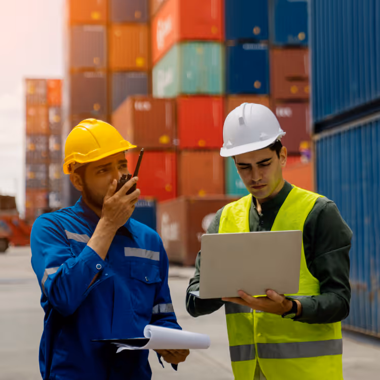 Small white human figurines standing on a dark blue circuit board pattern symbolizing digital networking.