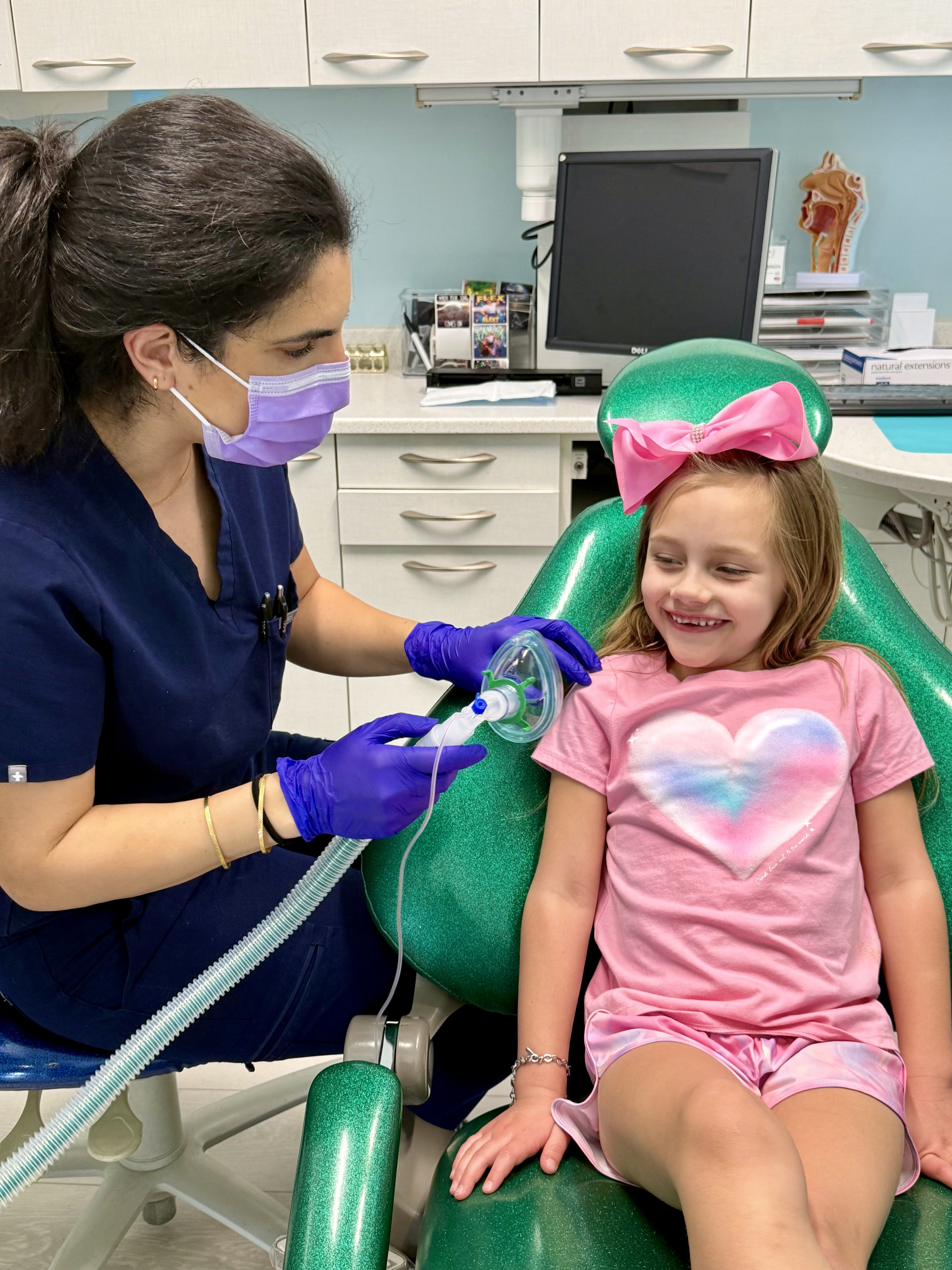image of a smiling patient in a dental chair