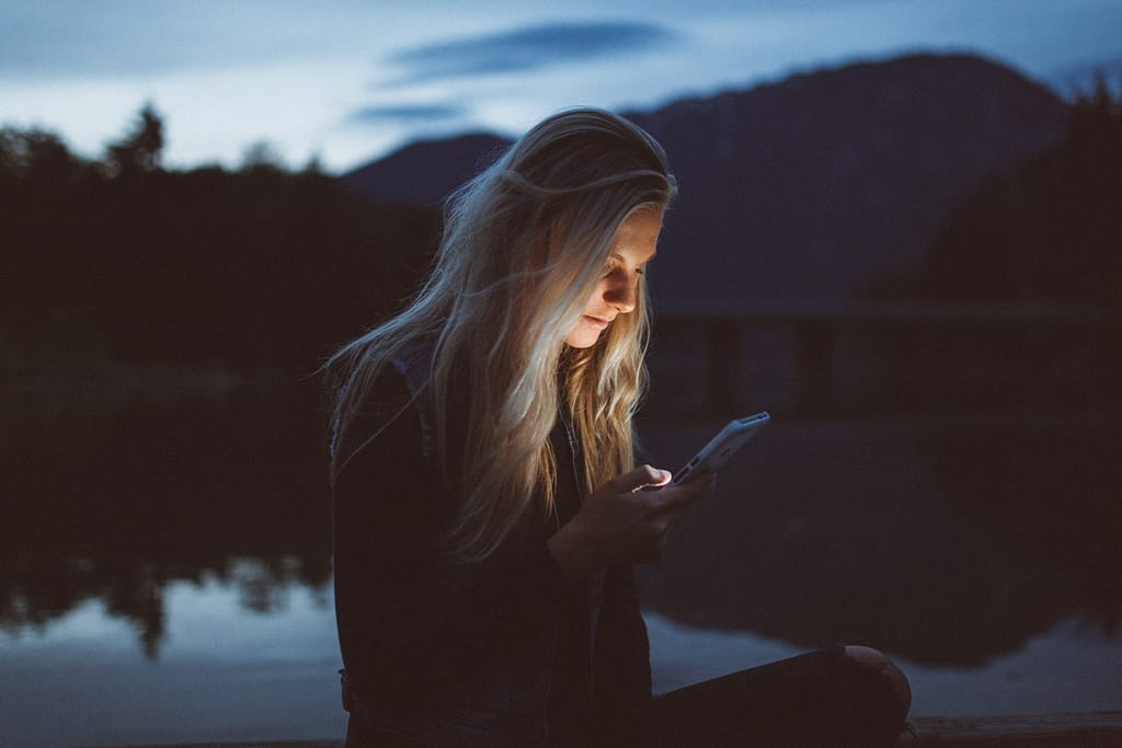 girl looking at social media content at night