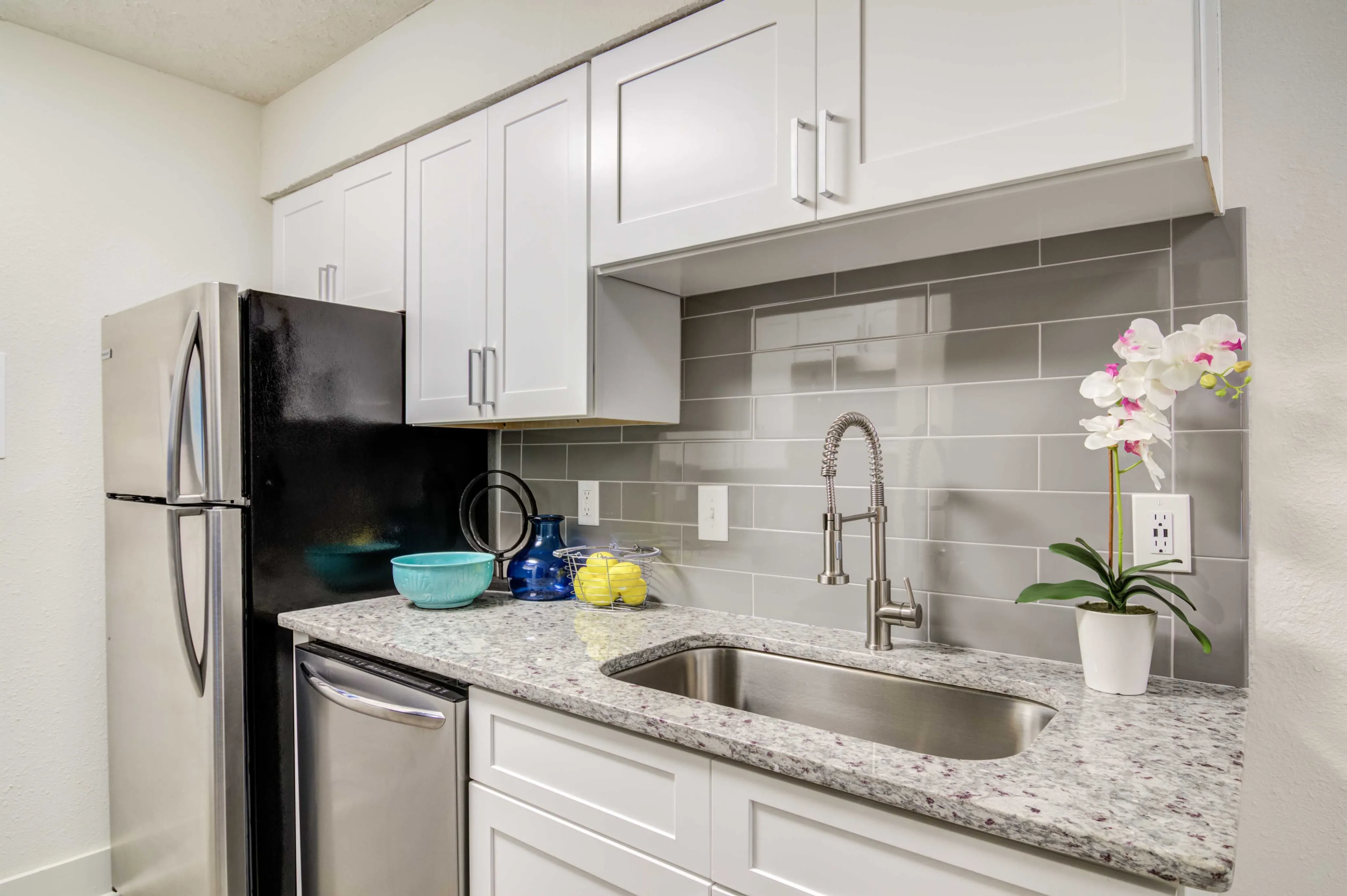 Kitchen with white cabinets and stainless steel appliances
