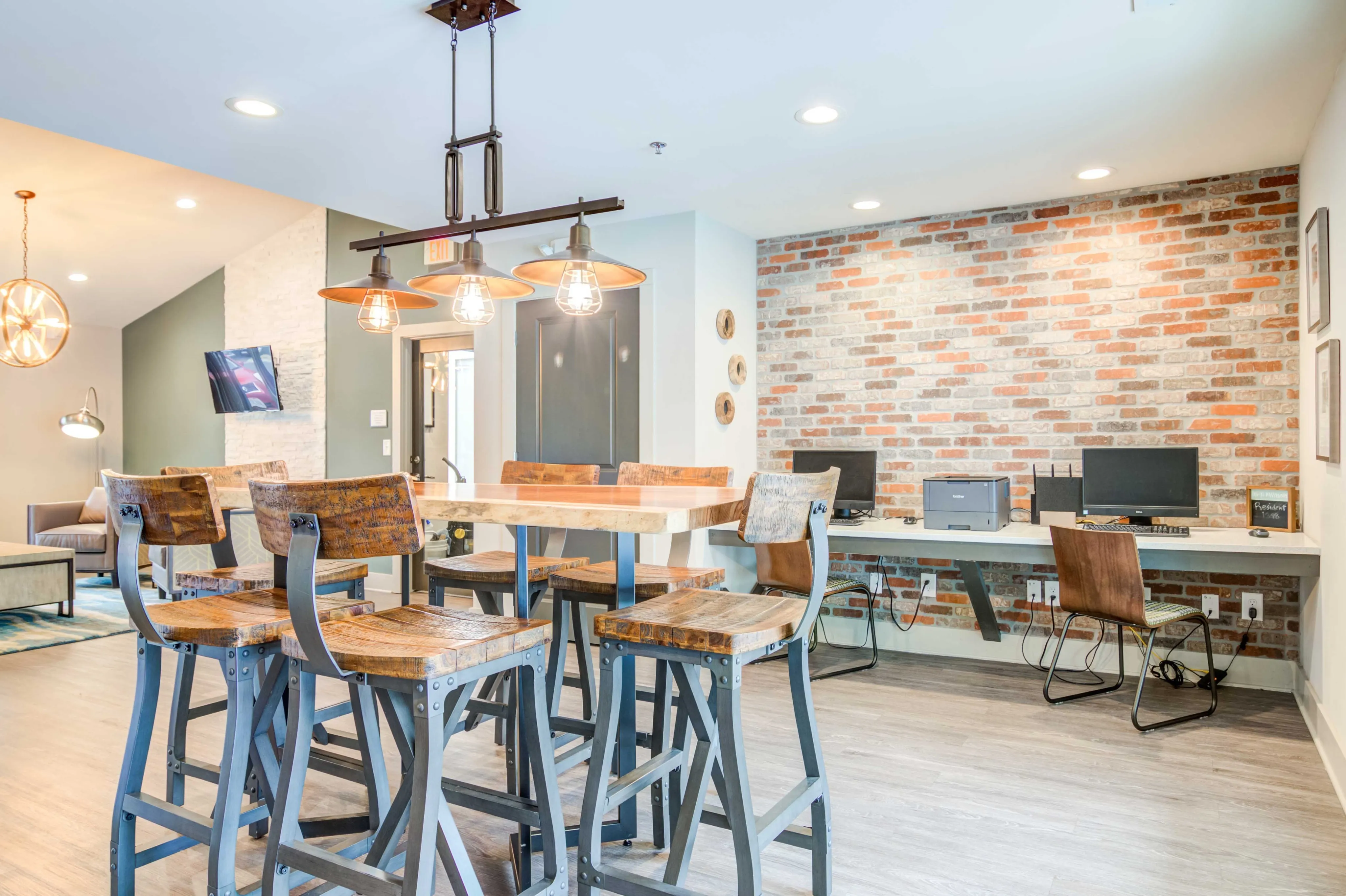 Table and chairs seating and business center with computers