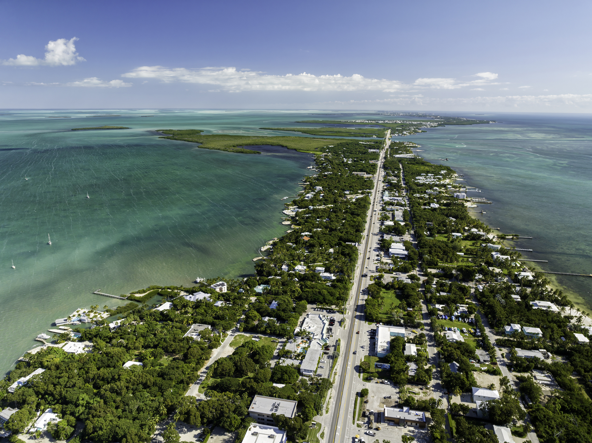 High-angle aerial view of Islamorada in the Florida Keys, known for its coral reefs, turquoise water, and world-class sportsfishing.