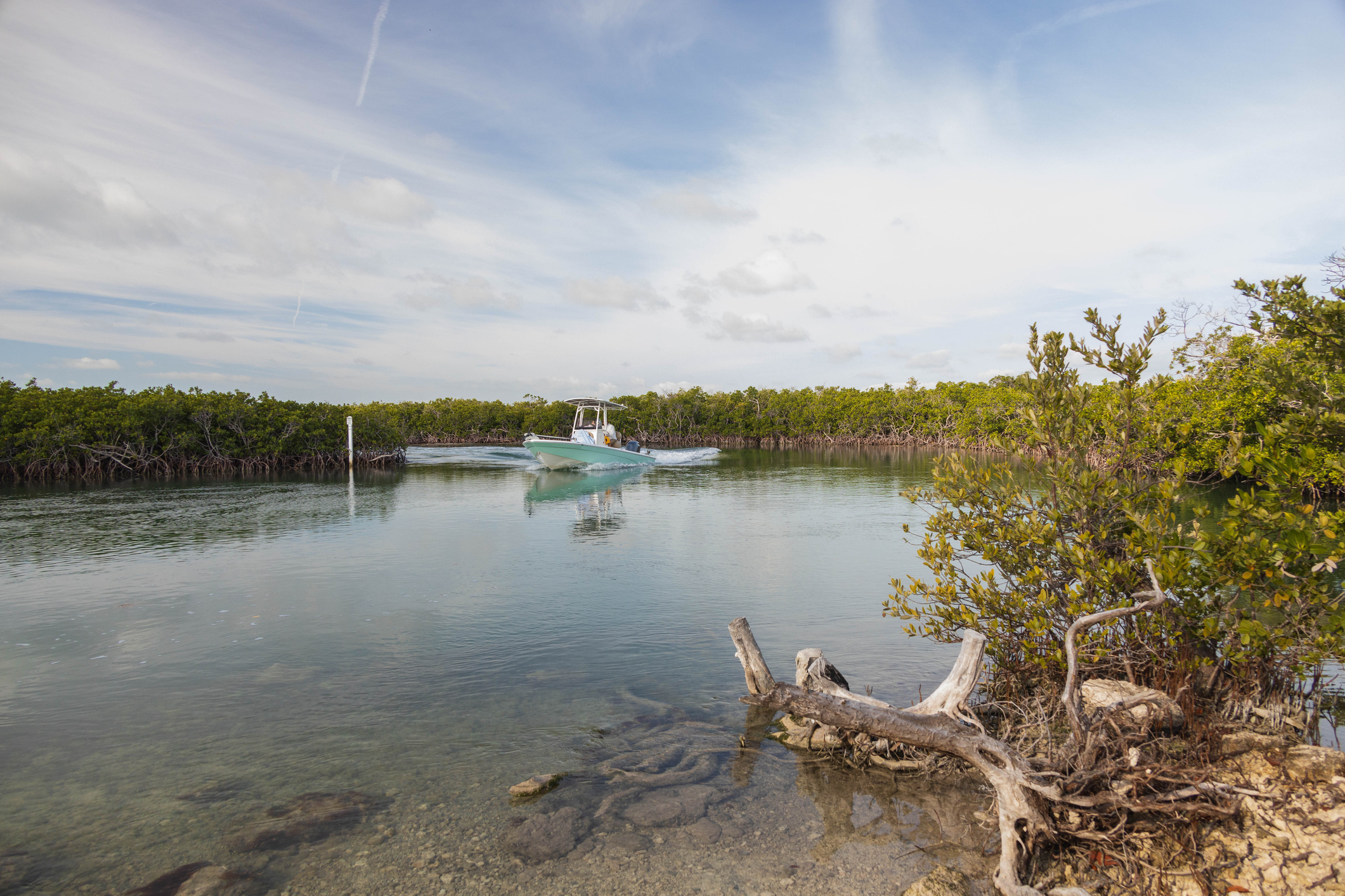 Fishing boat coming down a water channel in the Florida Keys