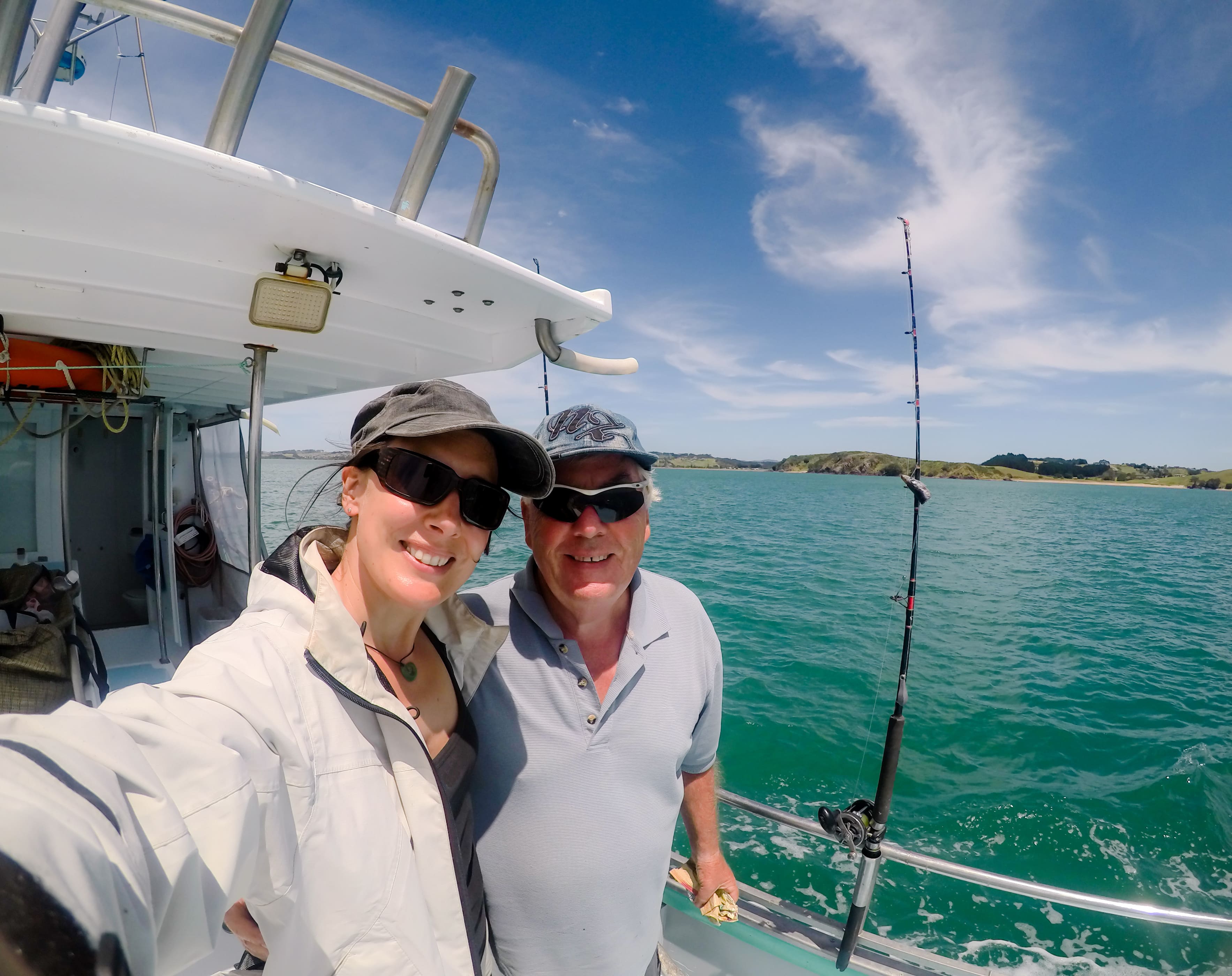 A father and daughter smiling at the camera while on a fishing charter tour in Islamadora, Fl. 