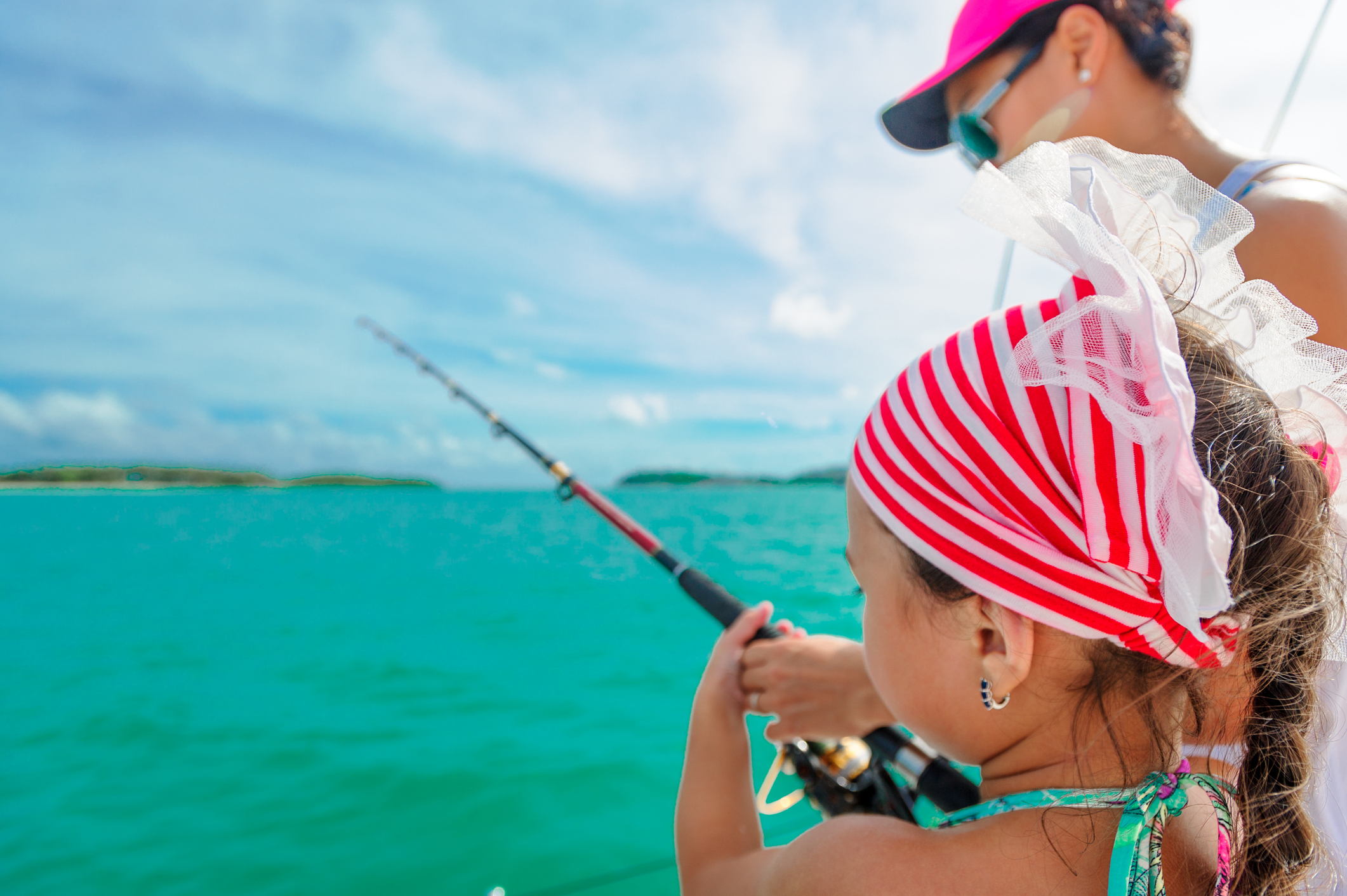 A girl and her mom enjoy an inshore fishing tour in Islamorada, Florida.