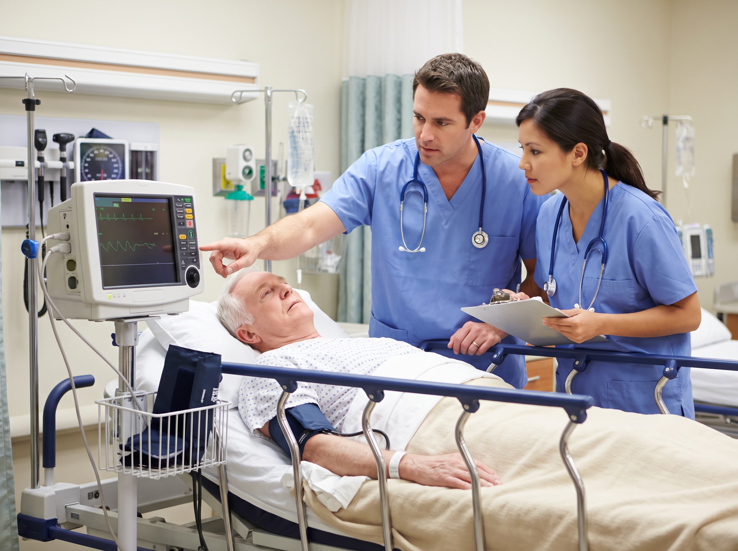 Clinicians assessing a patient with slow heart rhythm on a cardiac monitor