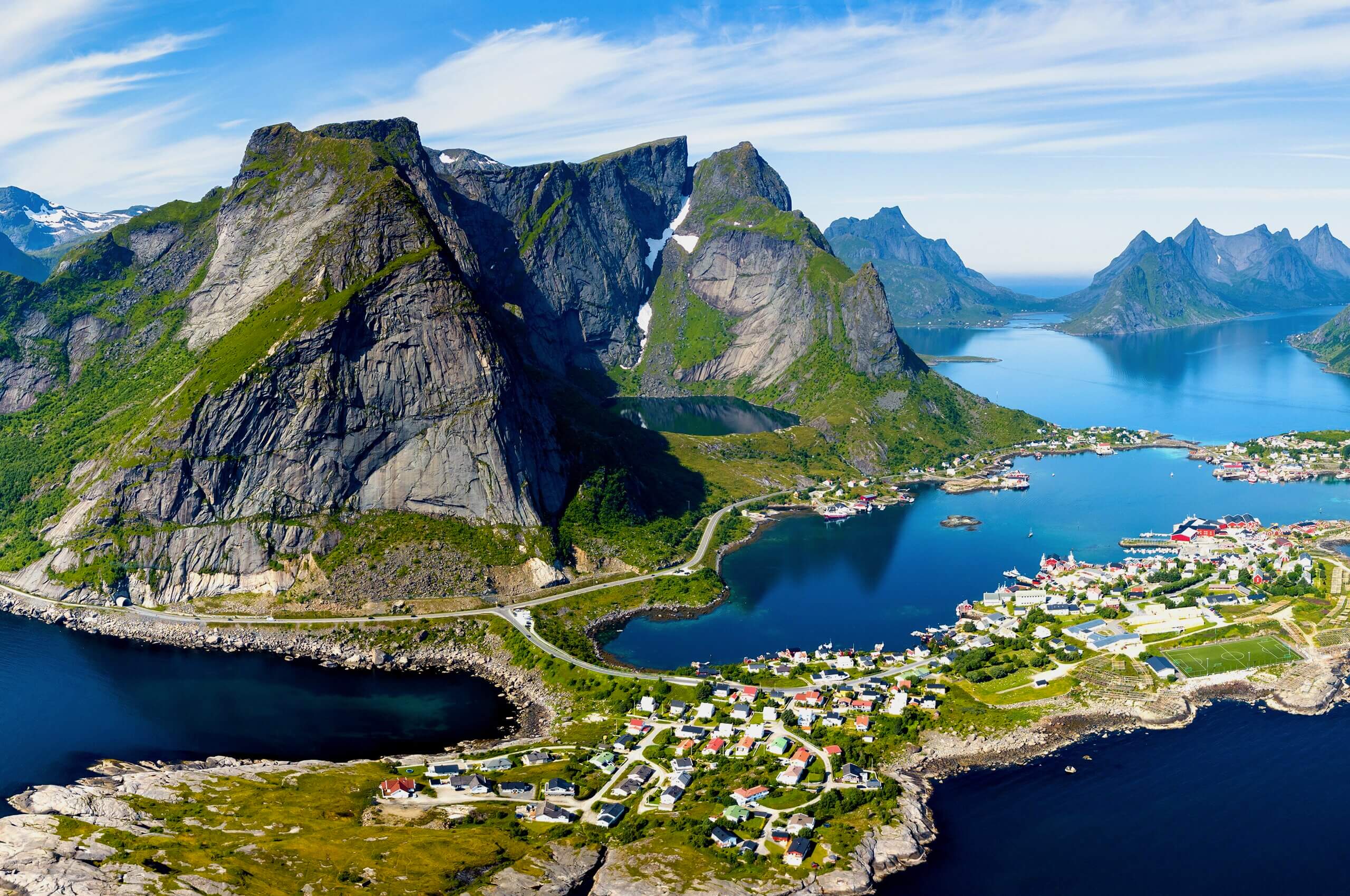 An aerial view of the mountains with water around.