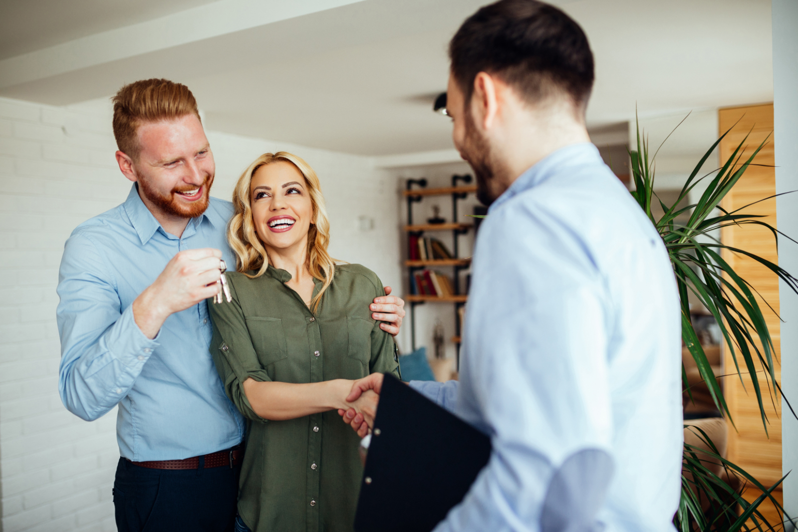 Man shaking woman's hand in office stock image