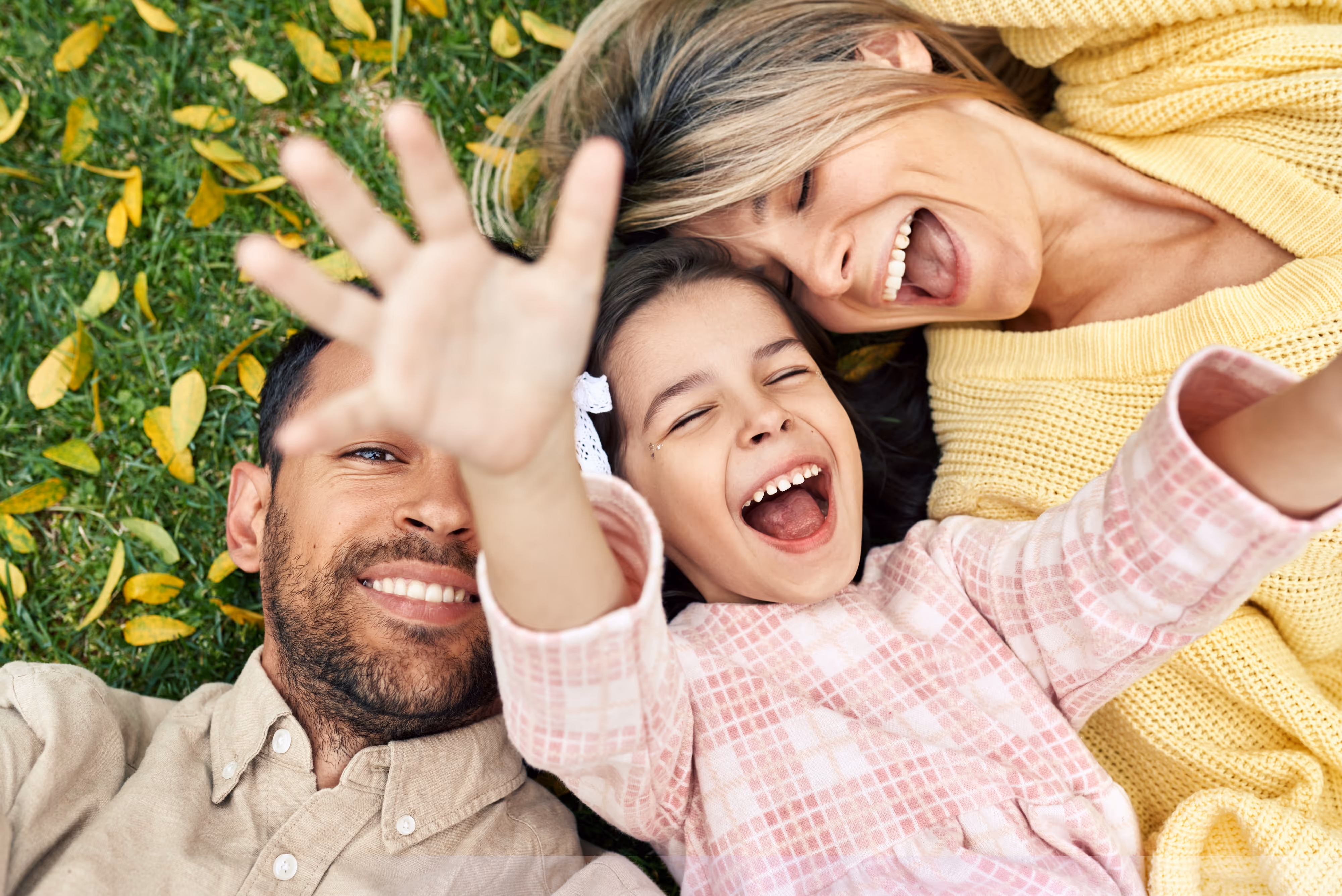 Family Relaxing on Grass Stock Photo